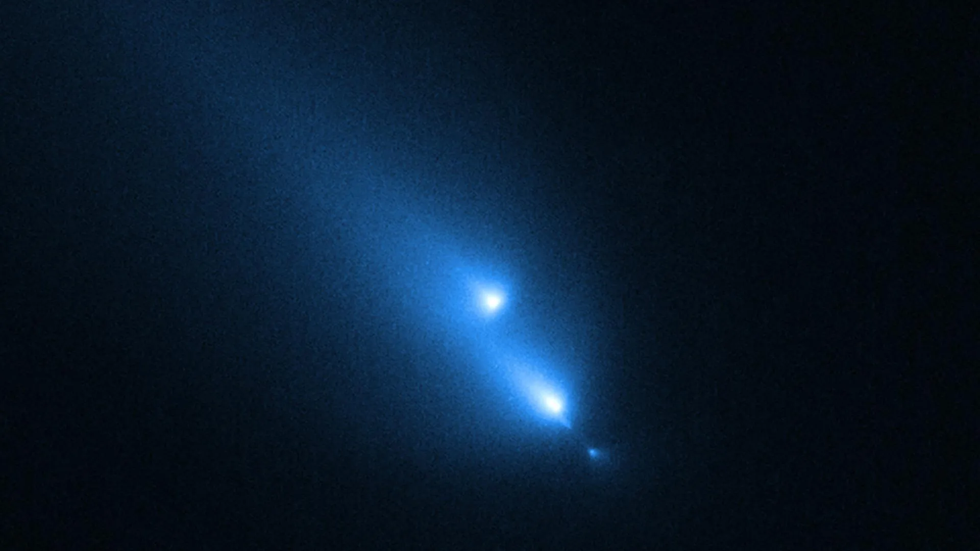 Hubble Catches Comet Breaking Apart